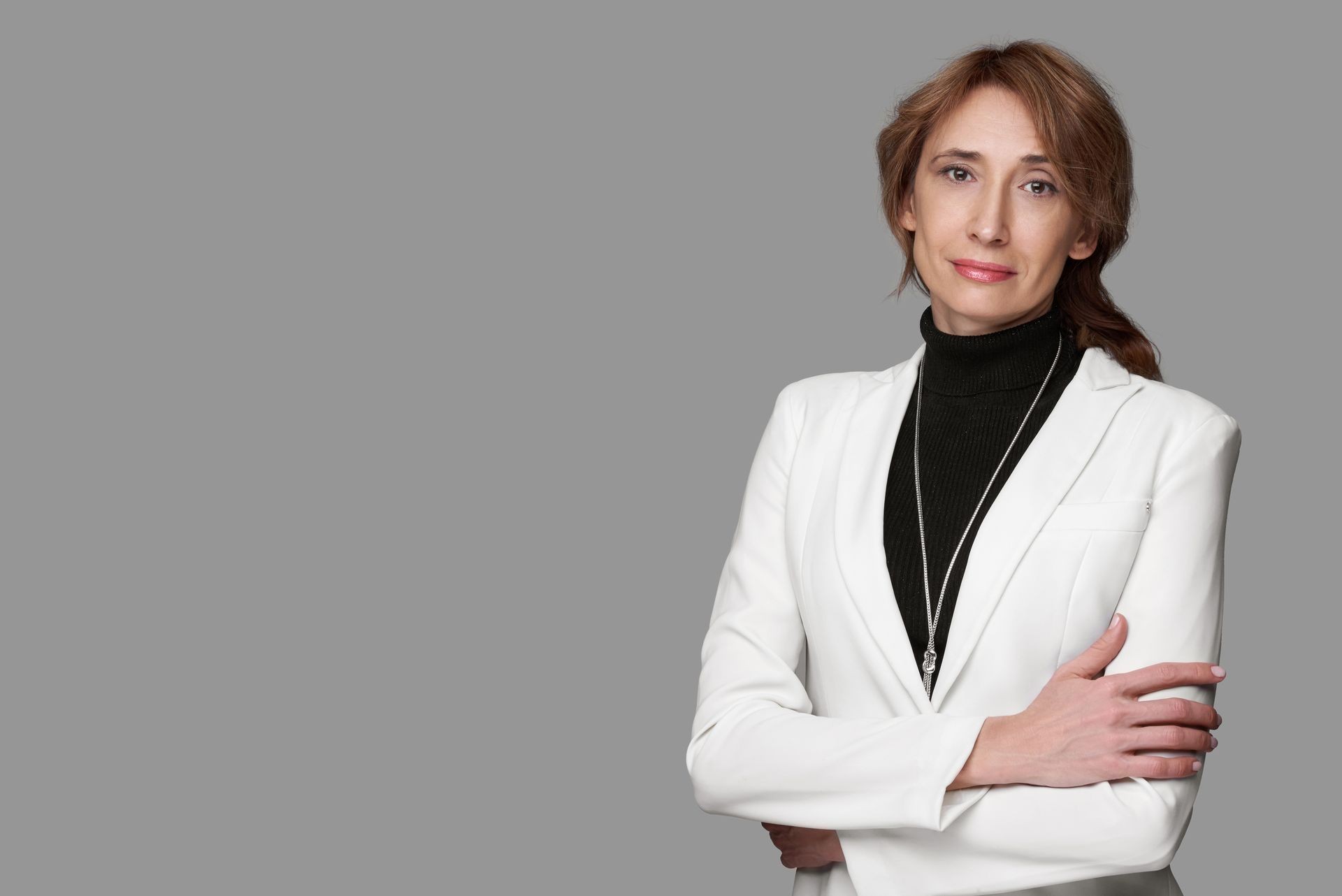 portrait of middle aged businesswoman isolated On grey background