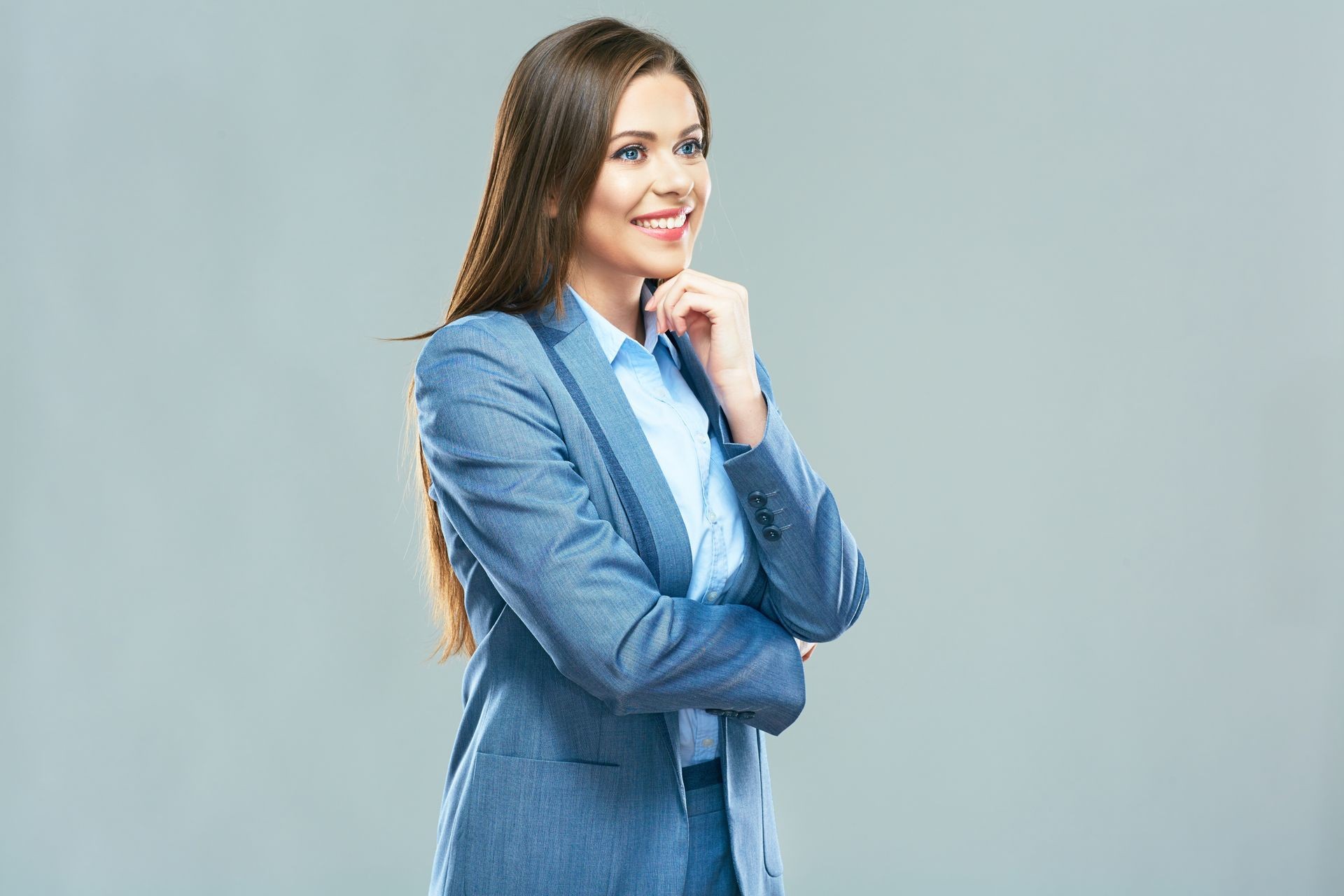 Thinking business woman portrait. Business woman office style suit dressed. Long hair. Face touching. Isolated studio.